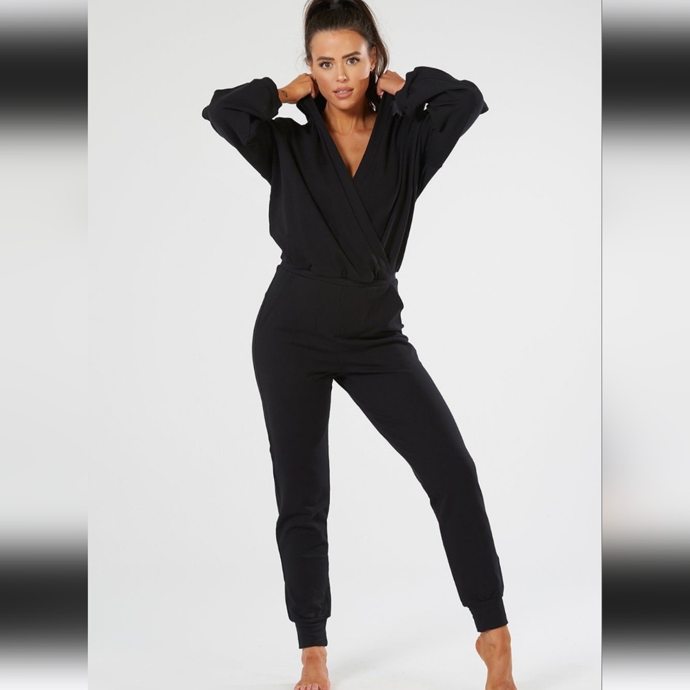 2 Brand new Namastetics Onesies (black and pink)